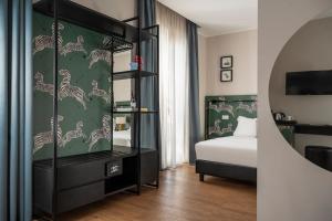 Postel nebo postele na pokoji v ubytování Hotel Vagabond + 37 fotografií