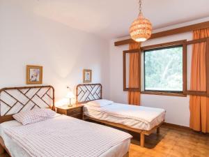 Ένα ή περισσότερα κρεβάτια σε δωμάτιο στο Villa MariaCanyamel By North Properties Mallorca +25 φωτογραφίες