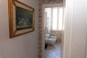 Photo de la galerie de l'établissement Le Boutique Luxury Rooms diffused in Historic Center, à Fiumicino