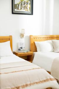 Voodi või voodid majutusasutuse AM Memory Central Hotel 2 toas