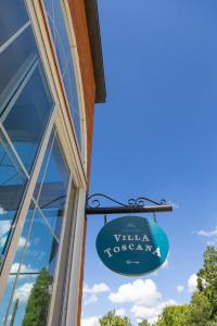 Et logo, certifikat, skilt eller en pris der bliver vist frem på Villa Toscana - Vale dos Vinhedos