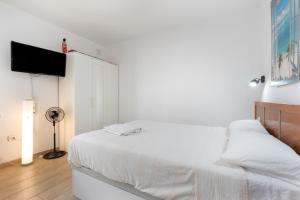 Posteľ alebo postele v izbe v ubytovaní Central Bright Studio