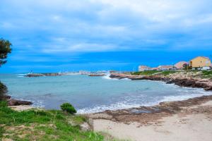 a view of the beach from a bluff at L'Anisé - Maison climatisée in Martigues
