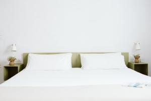 Postel nebo postele na pokoji v ubytování OttoH Charm Stay