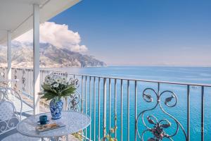 a balcony with a table and a view of the ocean at Villa Blue Sea Amalfi by Elite Villas in Ravello