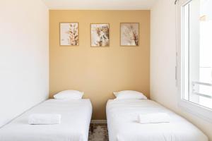 Katil atau katil-katil dalam bilik di GuestReady - A Touch of Elegance in Romainville
