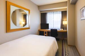 Postel nebo postele na pokoji v ubytování Hotel Sunroute Plaza Shinjuku
