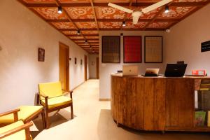 an office with two chairs and a desk with two laptops at Local Lok in Varanasi