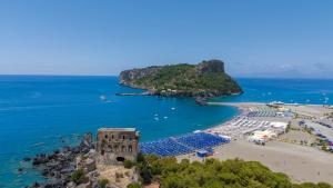 an aerial view of a beach with an island at Villaggio Turistico La Mantinera - Residence in Praia a Mare