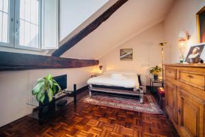 a bedroom with a bed in a attic at HOUSE with TERRACE in Turin +48 photos