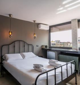 a bedroom with a bed with two towels on it at B&B Sweet Sleep in Naples +135 photos