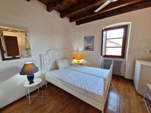 Postel nebo postele na pokoji v ubytování The Gulf Sailor's Cottage - Lago Maggiore
