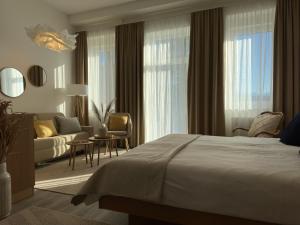 Postel nebo postele na pokoji v ubytování Strandhotel Kärntnerhof
