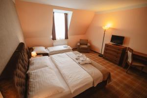 Posteľ alebo postele v izbe v ubytovaní Hotel Solisko