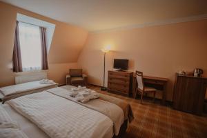 Posteľ alebo postele v izbe v ubytovaní Hotel Solisko