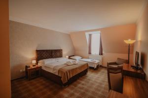 Posteľ alebo postele v izbe v ubytovaní Hotel Solisko