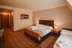 Posteľ alebo postele v izbe v ubytovaní Hotel Solisko