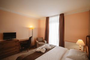 Posteľ alebo postele v izbe v ubytovaní Hotel Solisko