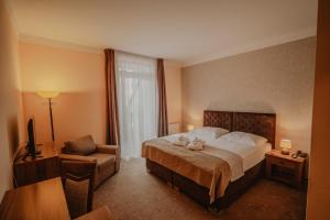 Posteľ alebo postele v izbe v ubytovaní Hotel Solisko
