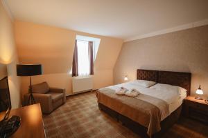 Posteľ alebo postele v izbe v ubytovaní Hotel Solisko