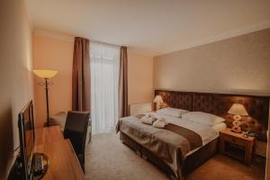 Posteľ alebo postele v izbe v ubytovaní Hotel Solisko