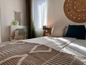 Postel nebo postele na pokoji v ubytování Strandhotel Kärntnerhof