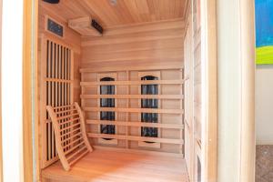 a sauna with a wooden staircase in a house at appartement CENTRUM 4 in Ostend
