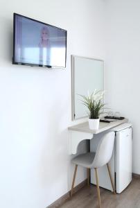 TV a/nebo společenská místnost v ubytování Relax Mea Hotel