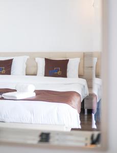Postel nebo postele na pokoji v ubytování Relax Mea Hotel
