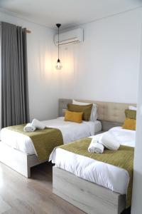 Postel nebo postele na pokoji v ubytování Relax Mea Hotel