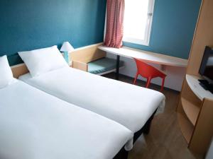 Postel nebo postele na pokoji v ubytování Hotel ibis Narbonne
