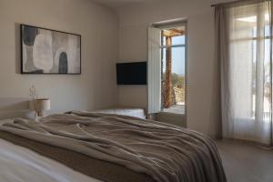 Postel nebo postele na pokoji v ubytování Stamna Sifnos a member of Design Hotels