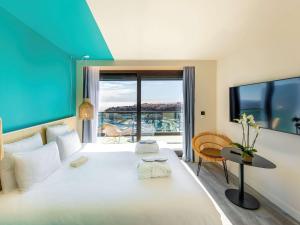 Vuode tai vuoteita majoituspaikassa Novotel Monte-Carlo