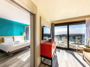 Vuode tai vuoteita majoituspaikassa Novotel Monte-Carlo