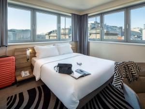 Ένα ή περισσότερα κρεβάτια σε δωμάτιο στο Novotel Wien City