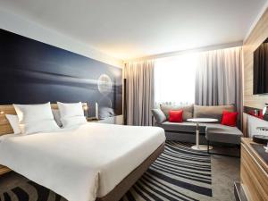 Ένα ή περισσότερα κρεβάτια σε δωμάτιο στο Novotel Wien City