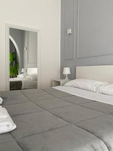Postel nebo postele na pokoji v ubytování Quintino Sella rooms