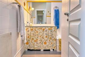 a bathroom with a sink and a mirror at Lblab11A La Brana in San Vicente de la Barquera +45 photos
