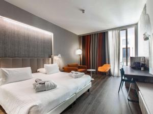 Postel nebo postele na pokoji v ubytování Mercure Firenze Centro