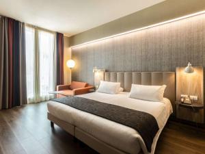 Postel nebo postele na pokoji v ubytování Mercure Firenze Centro