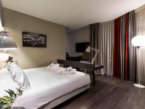 Postel nebo postele na pokoji v ubytování Mercure Firenze Centro
