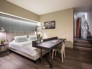 Postel nebo postele na pokoji v ubytování Mercure Firenze Centro
