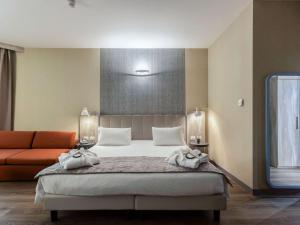 Postel nebo postele na pokoji v ubytování Mercure Firenze Centro
