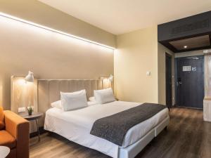 Postel nebo postele na pokoji v ubytování Mercure Firenze Centro