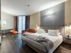 Postel nebo postele na pokoji v ubytování Mercure Firenze Centro