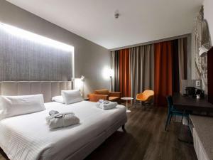 Postel nebo postele na pokoji v ubytování Mercure Firenze Centro