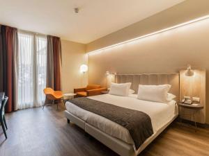 Postel nebo postele na pokoji v ubytování Mercure Firenze Centro