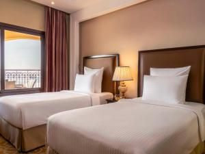 Postel nebo postele na pokoji v ubytování Pullman Resort Al Marjan Island + 37 fotografií