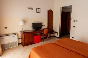 Postel nebo postele na pokoji v ubytování Hotel mariuccia