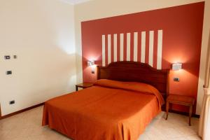 Postel nebo postele na pokoji v ubytování Hotel mariuccia